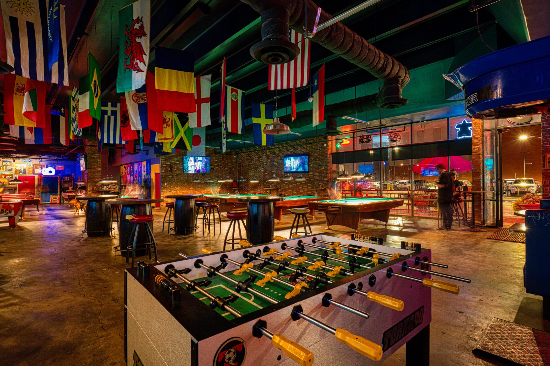table hockey and billiard tables with flags from different countries
