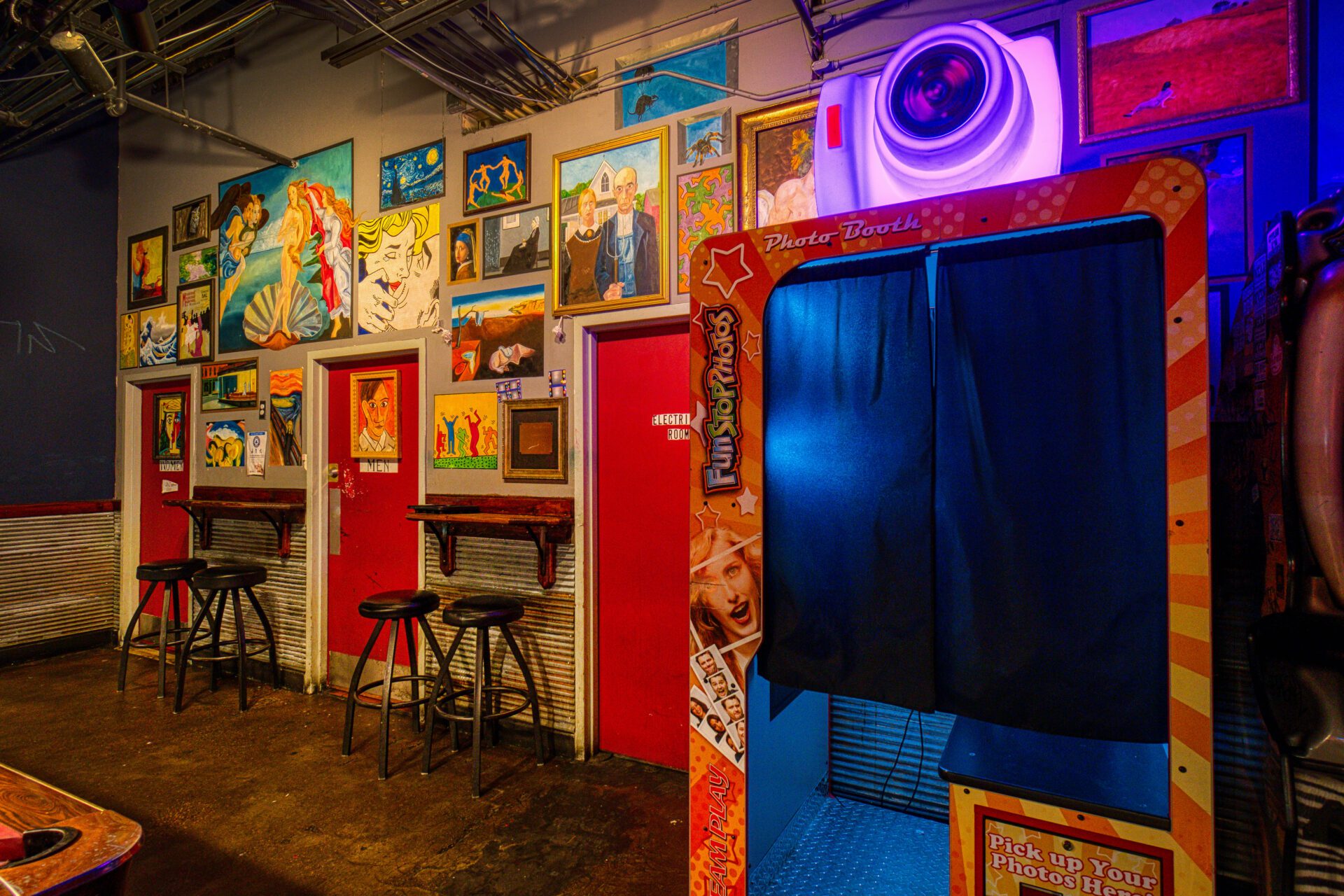 photo booth next to barstools and tables