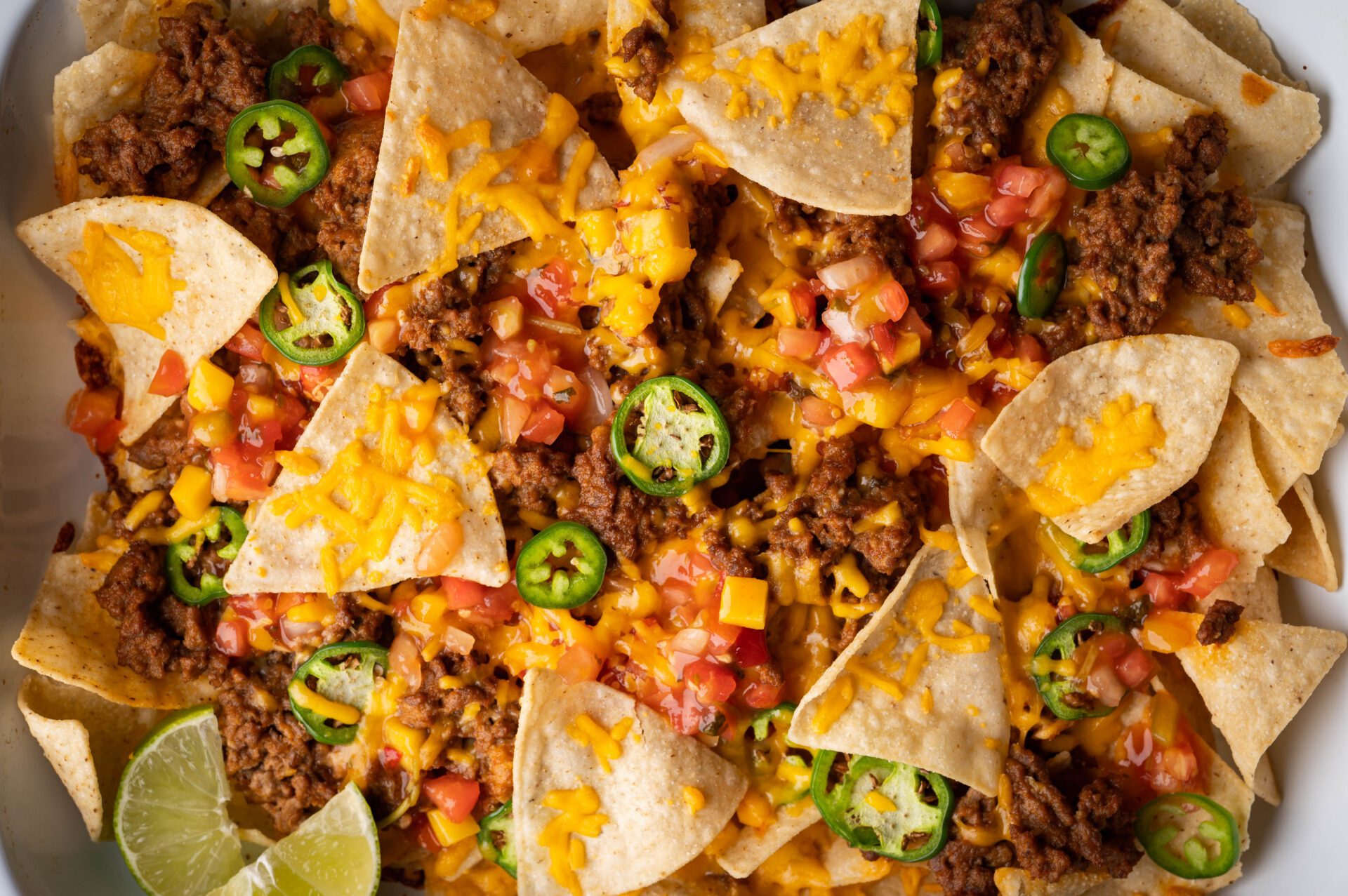 overhead platter of nachos with beef and vegetables